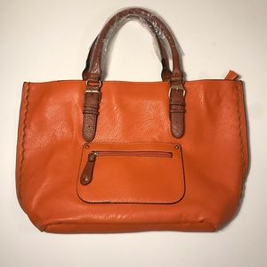 Orange faux leather purse with brown handles